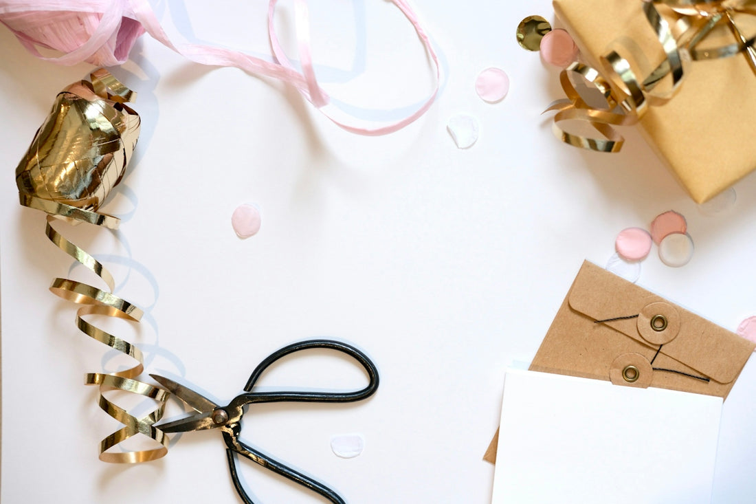Gift wrapping supplies with ribbon and confetti