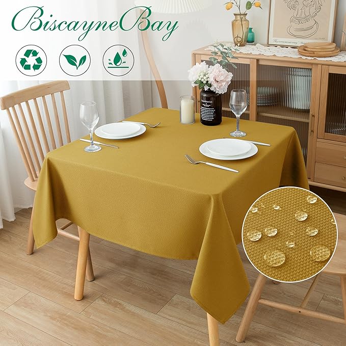 Biscaynebay Textured Fabric Christmas Square Table Cloth 90x90 Inches, Gold Water Resistant Tablecloths for Dining, Kitchen, Wedding and Parties etc. Machine Washable